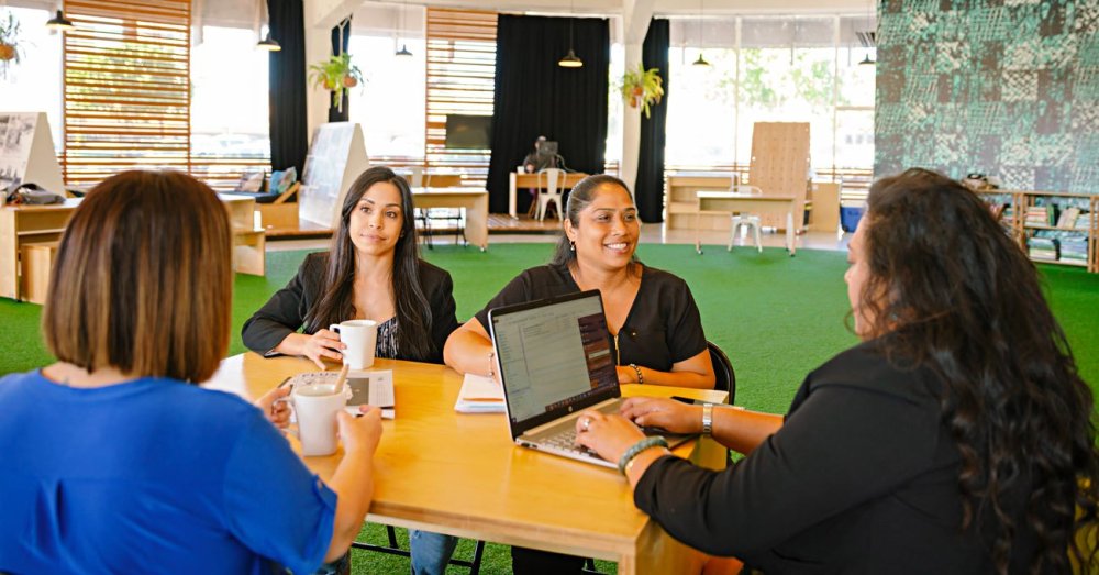 a group of people sitting at a table