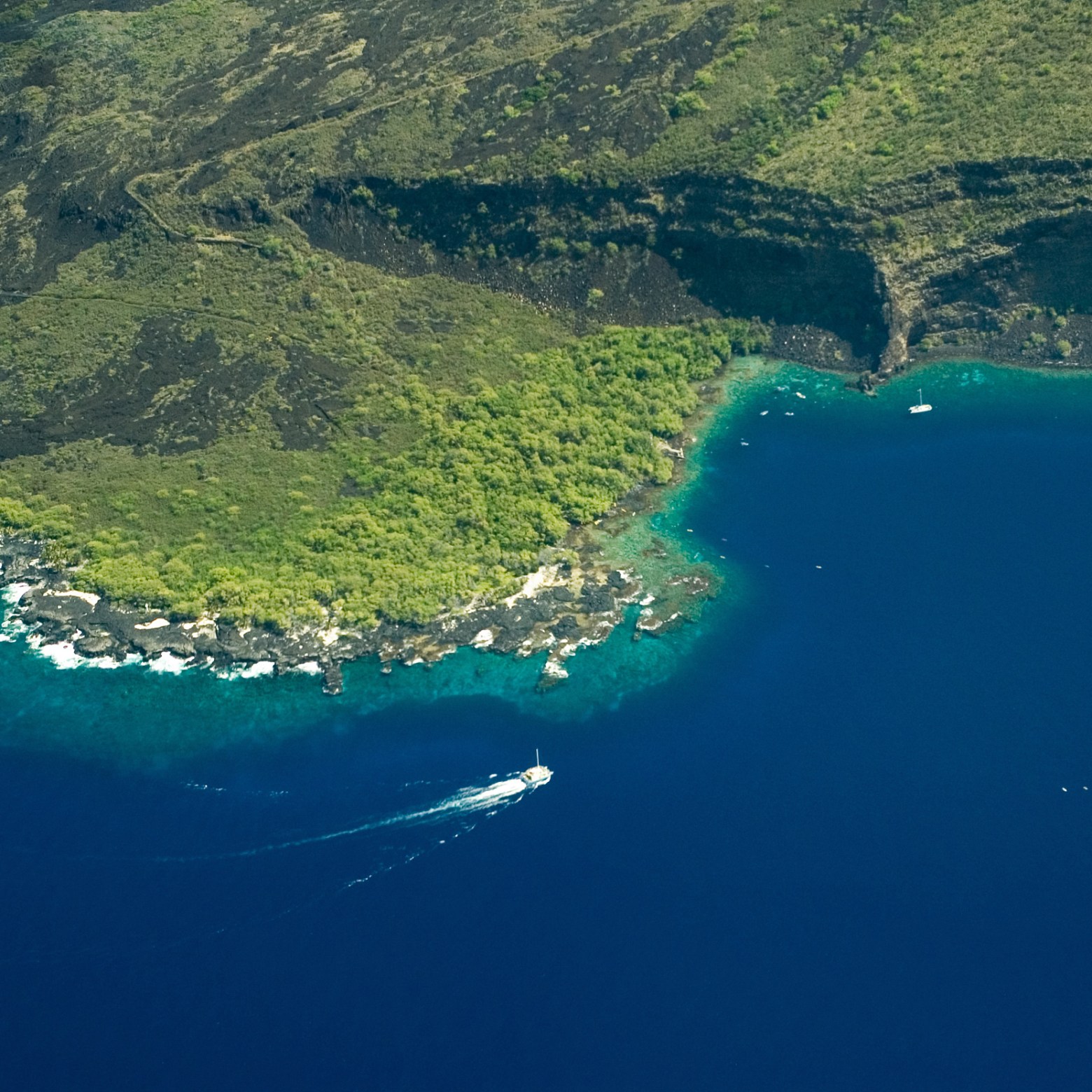 a body of water with a mountain in the background