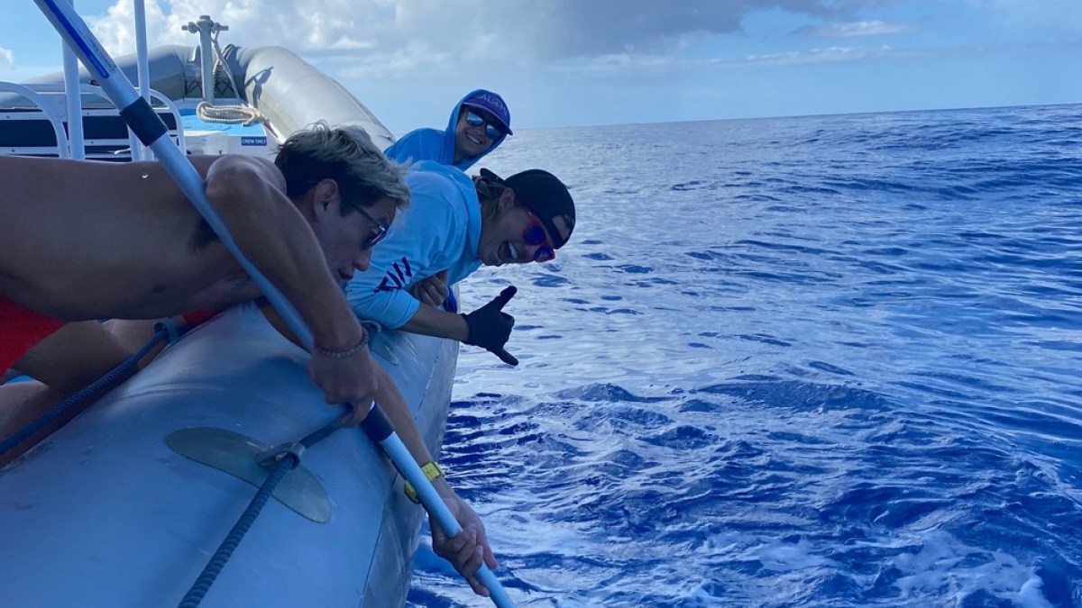 a man riding on the back of a boat