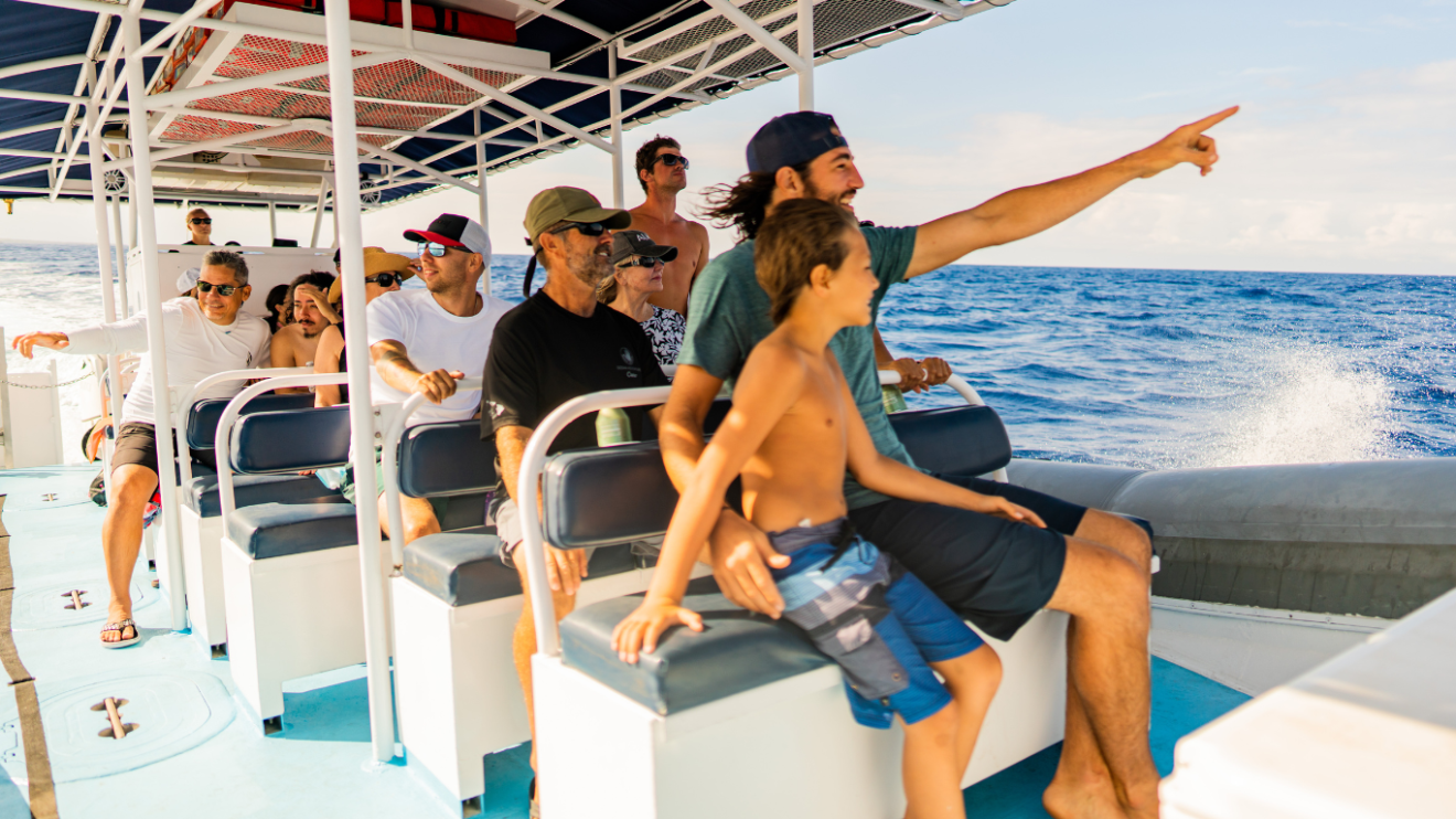 a father and son on a super raft snorkel tour in kona, hawaii