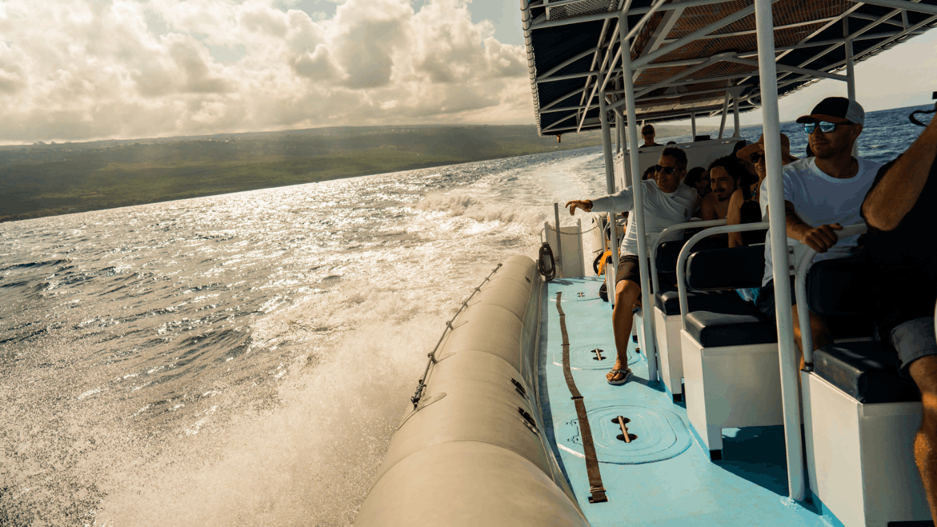 People on a big island sustainable tour with ocean waves and a cloudy sky